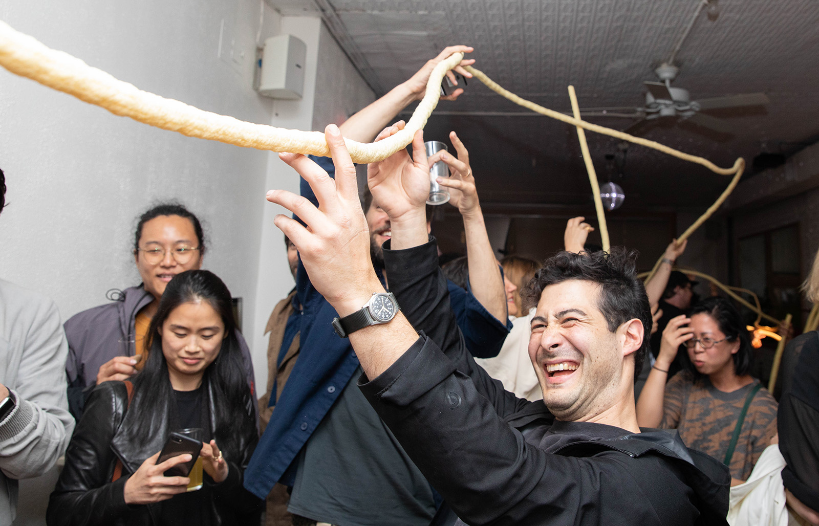 corn snack being passed down a crowd