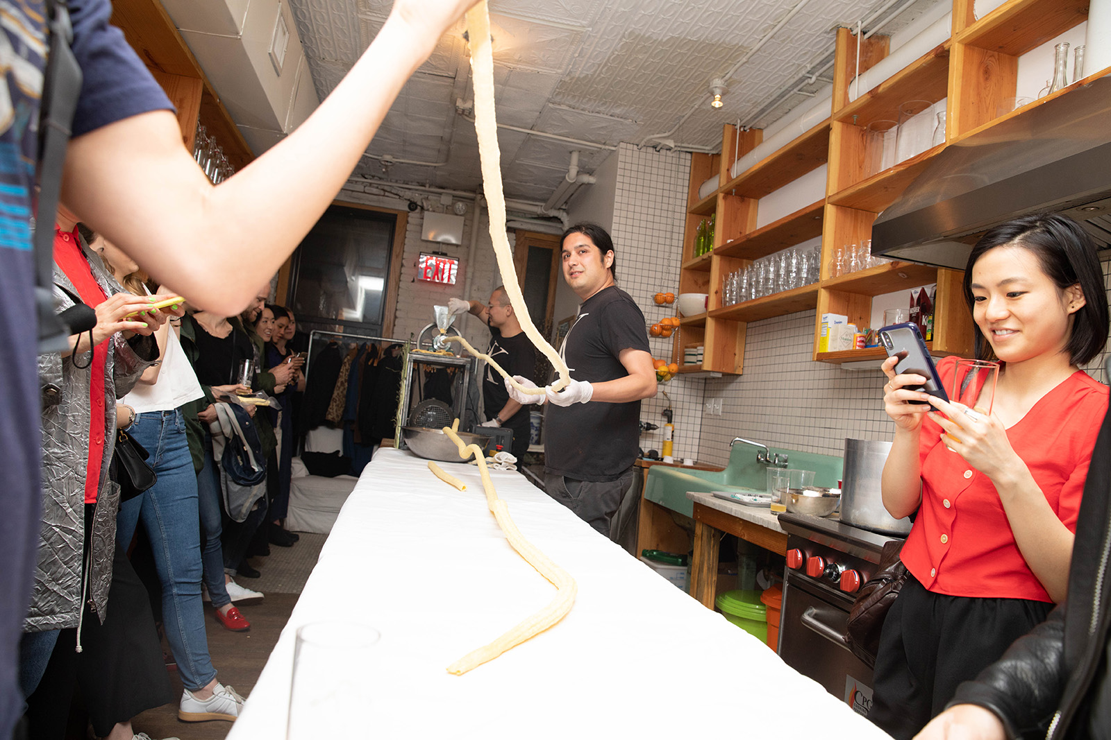 two people extruding a corn snack