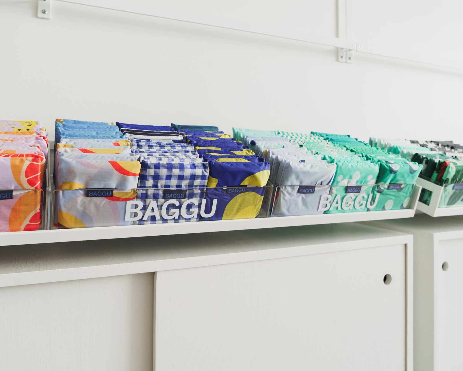 drawers of folded colorful BAGGU bags.