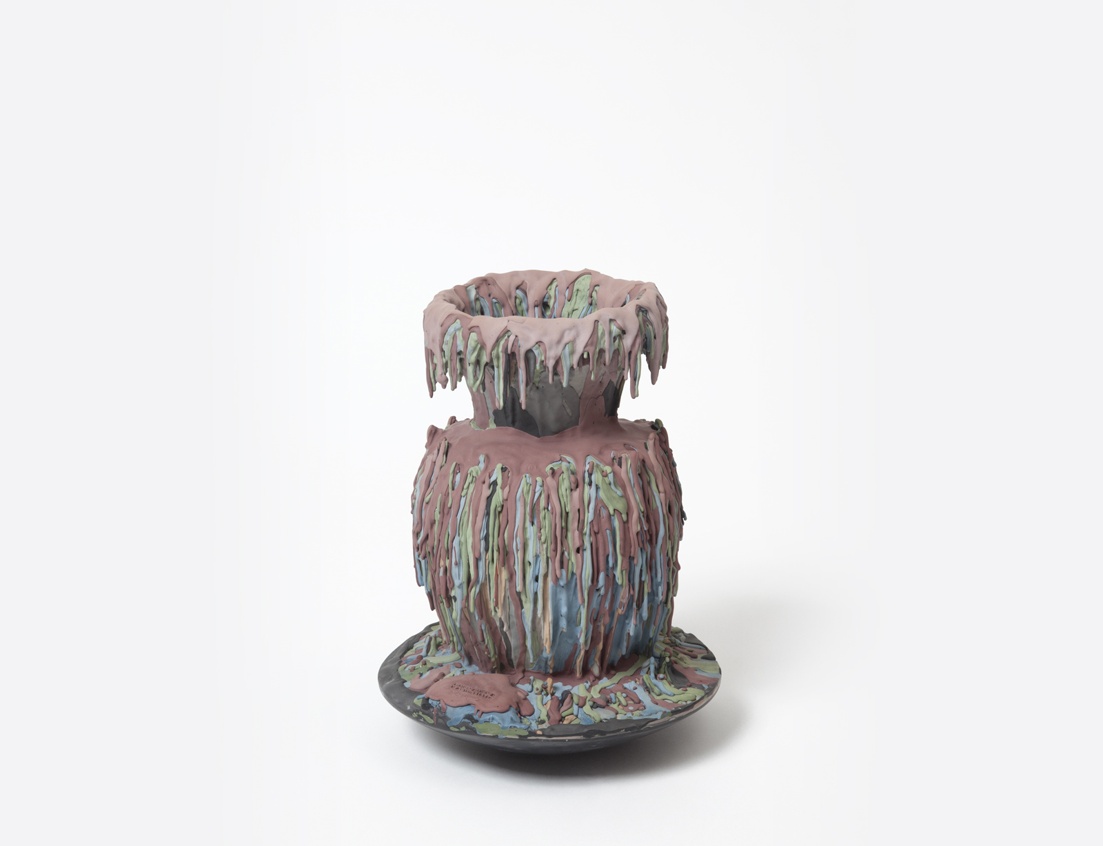 colored cement drip covered vase.