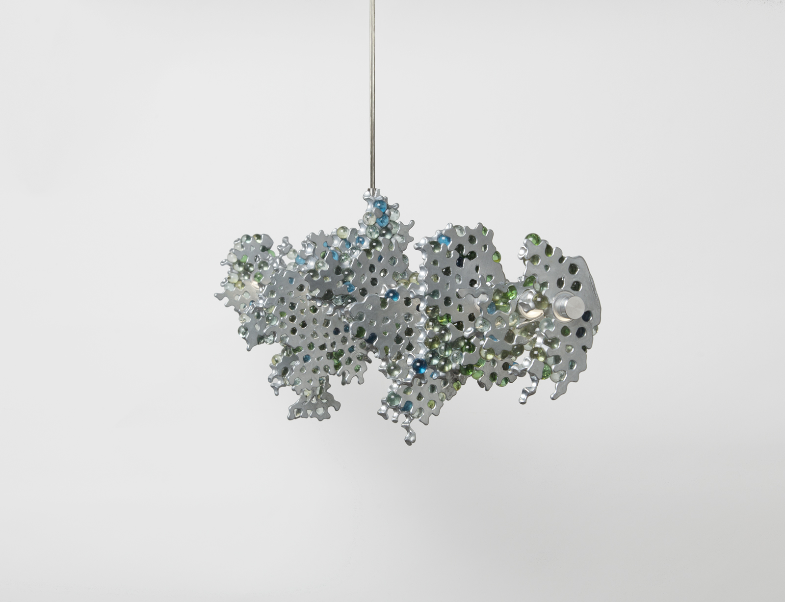 hanging light consisting of a main horizontal LED strip with glass marble clusters held together in aluminum chunks.