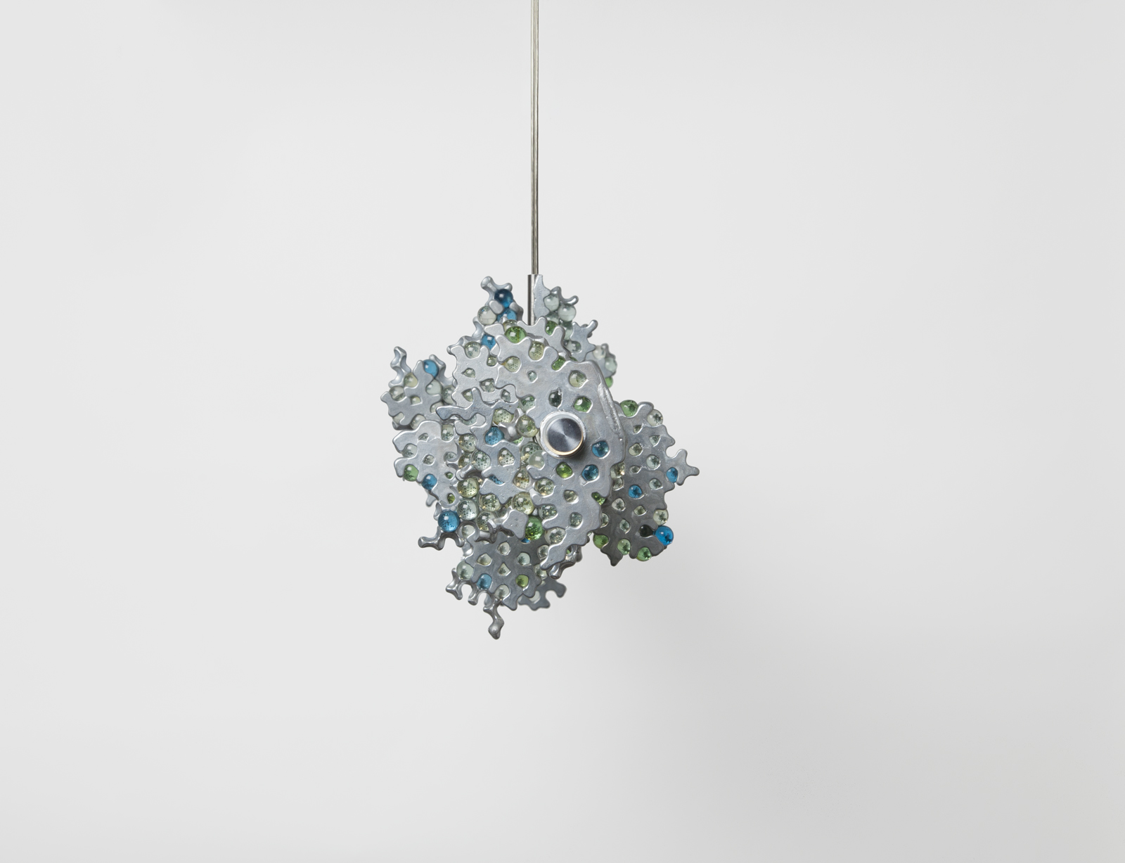 end view of hanging light consisting of a main horizontal LED strip with glass marble clusters held together in aluminum chunks.