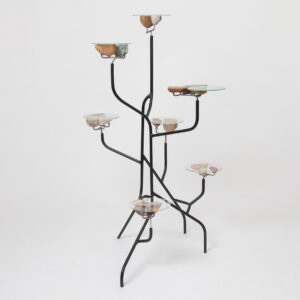 shelf made of metal tubes and glass with stone surfaces