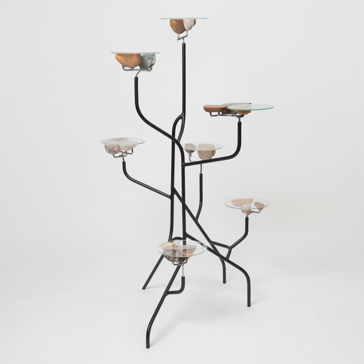 shelf made of metal tubes and glass with stone surfaces