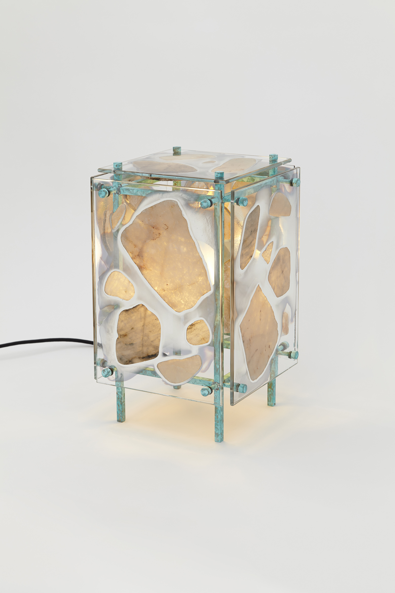 table light made from silvered glass panels with stones glued on, hanging off of a metal frame