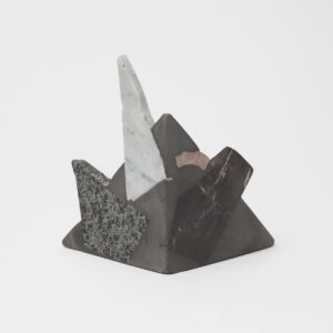 triangular bookend with rough rock chunks sticking out.