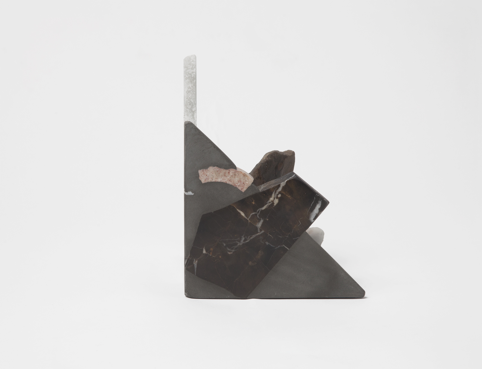 triangular bookend with rough rock chunks sticking out.