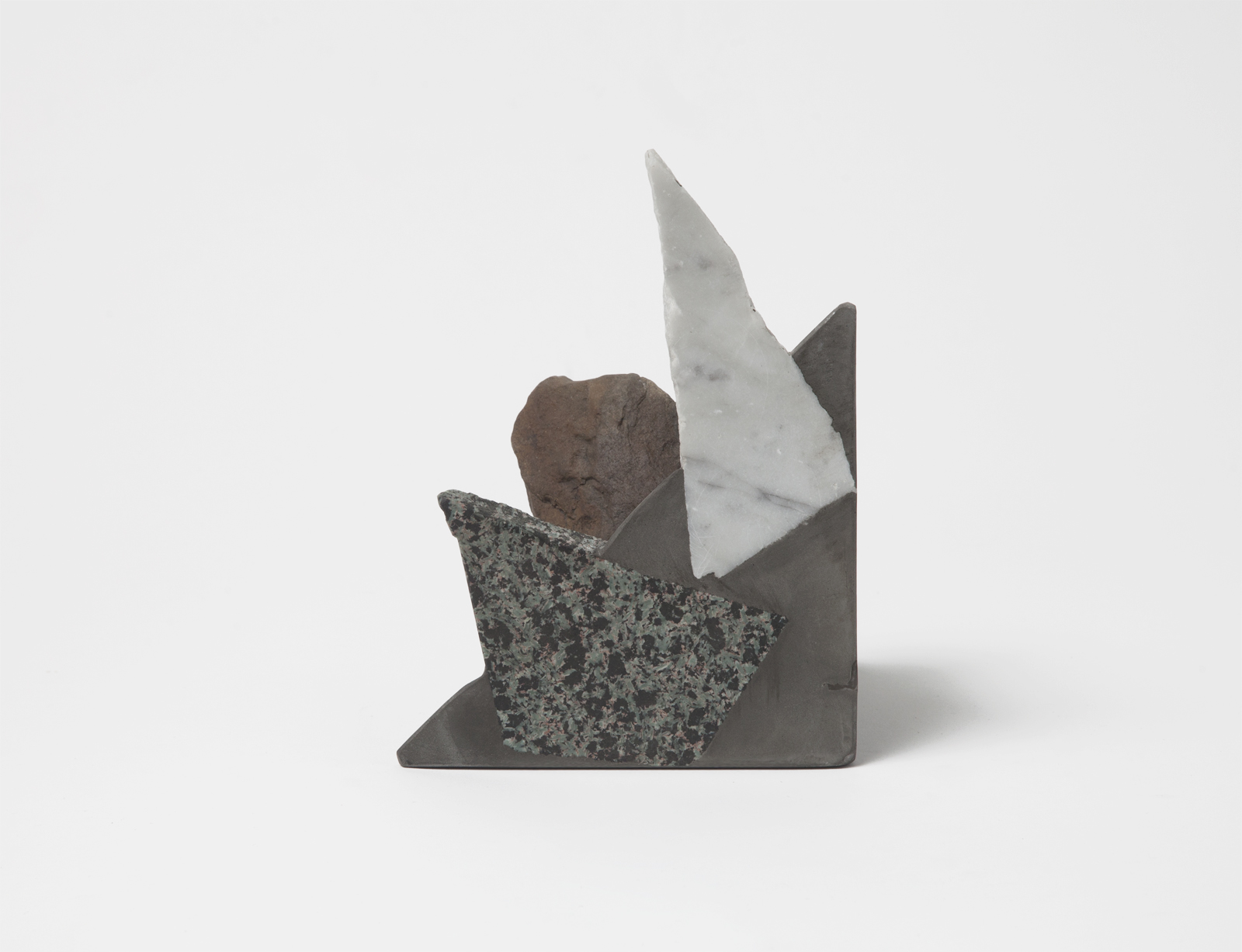 triangular bookend with rough rock chunks sticking out.