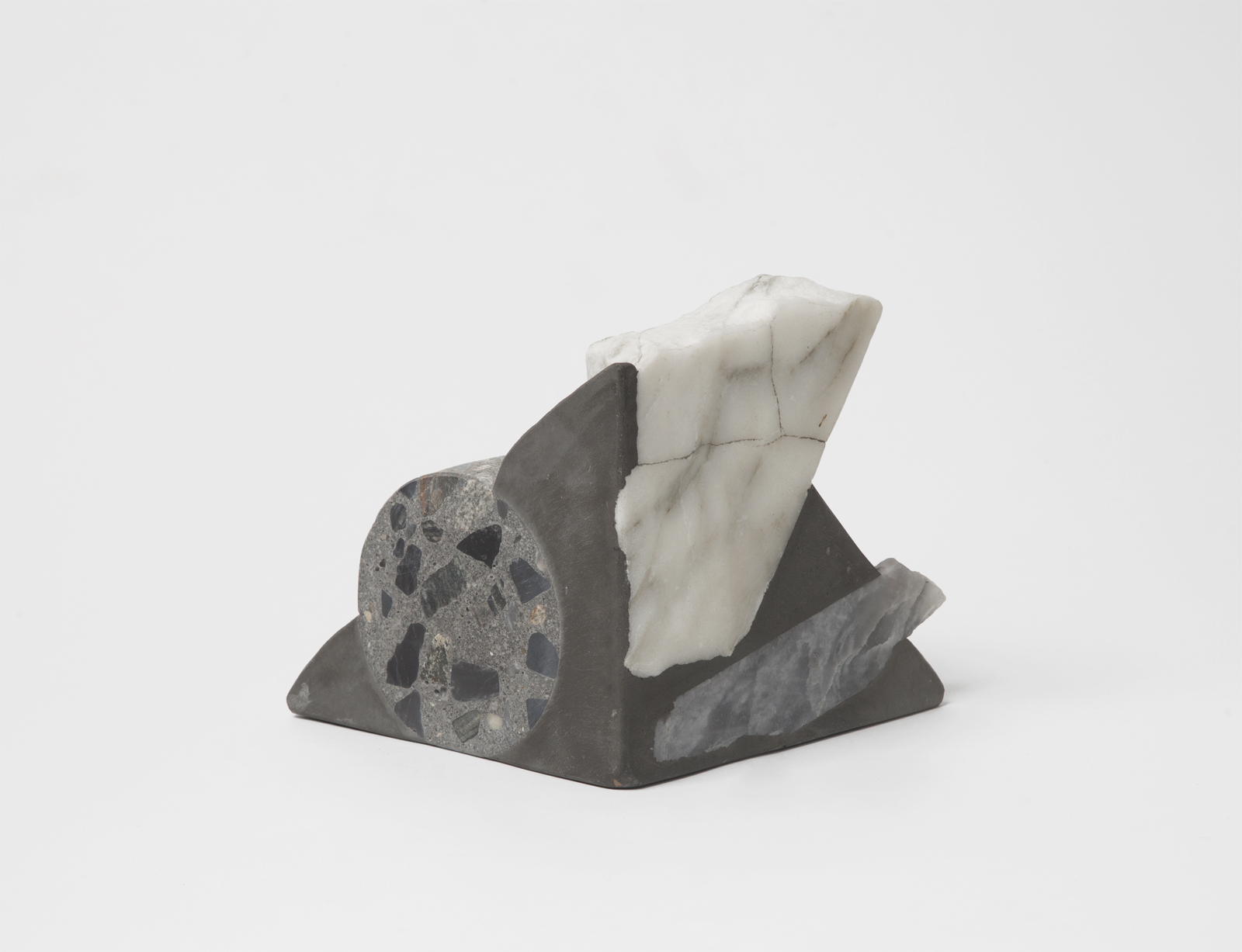 triangular bookend with rough rock chunks sticking out.