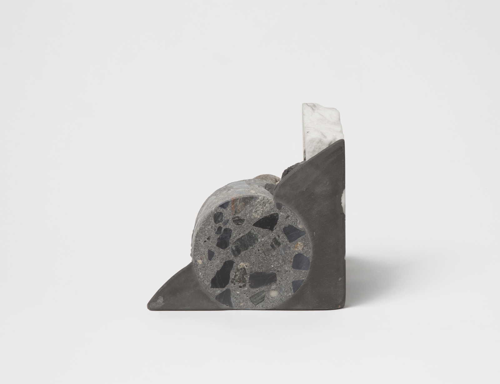 triangular bookend with rough rock chunks sticking out.