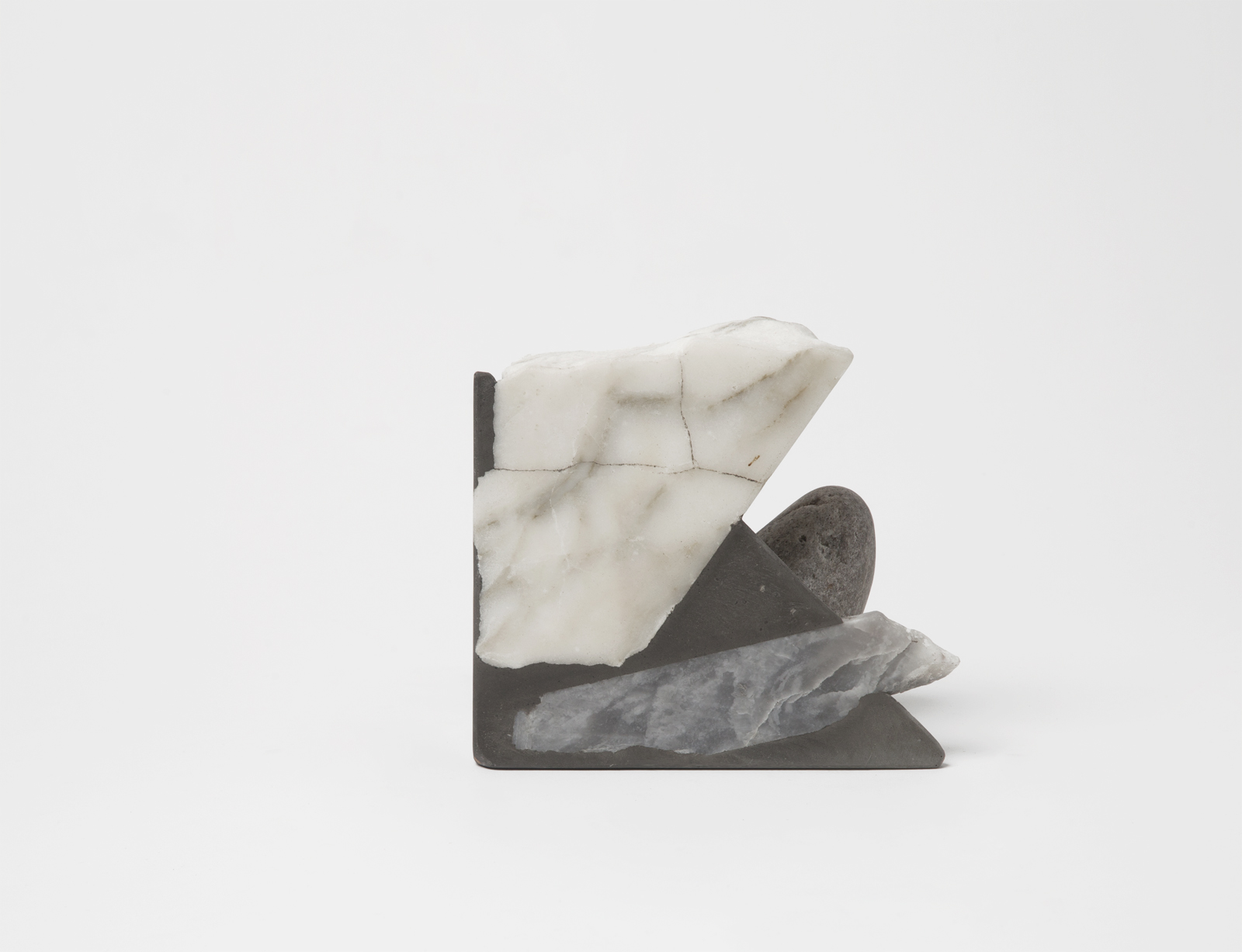 triangular bookend with rough rock chunks sticking out.