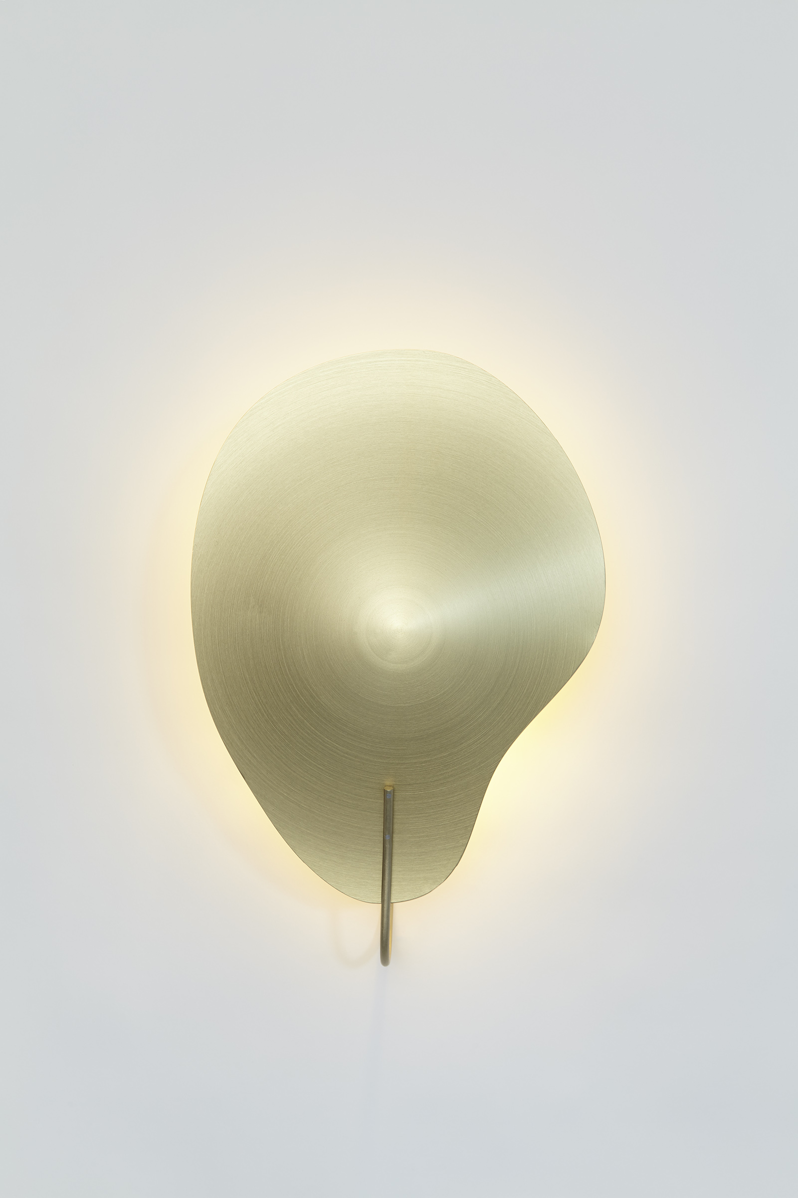 front view of gold color petal shaped wall mounted sconce.