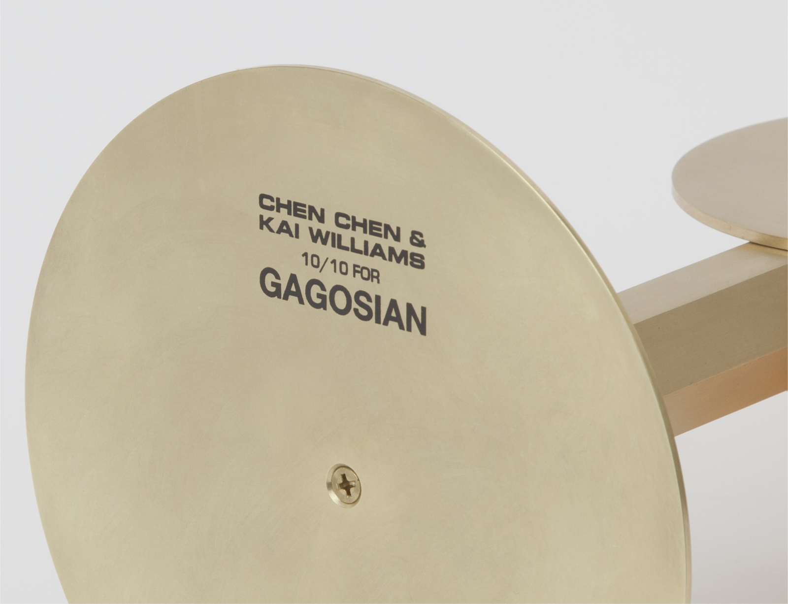 close up of brass object base with "Chen Chen & Kai Wiilliams 10/10 For GAGOSIAN" text.