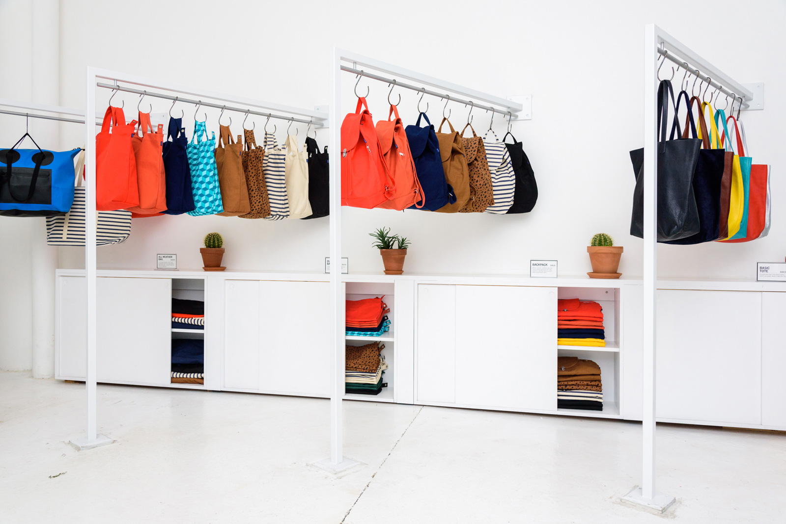 rows of white bag hanging systems and cabinets.