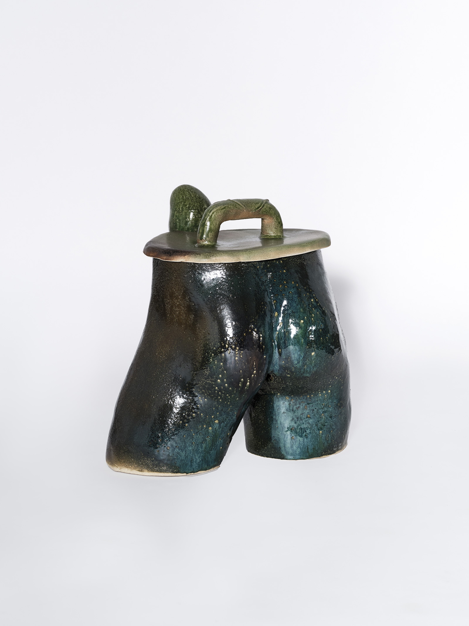 back view ceramic grill in the shape of male crotch