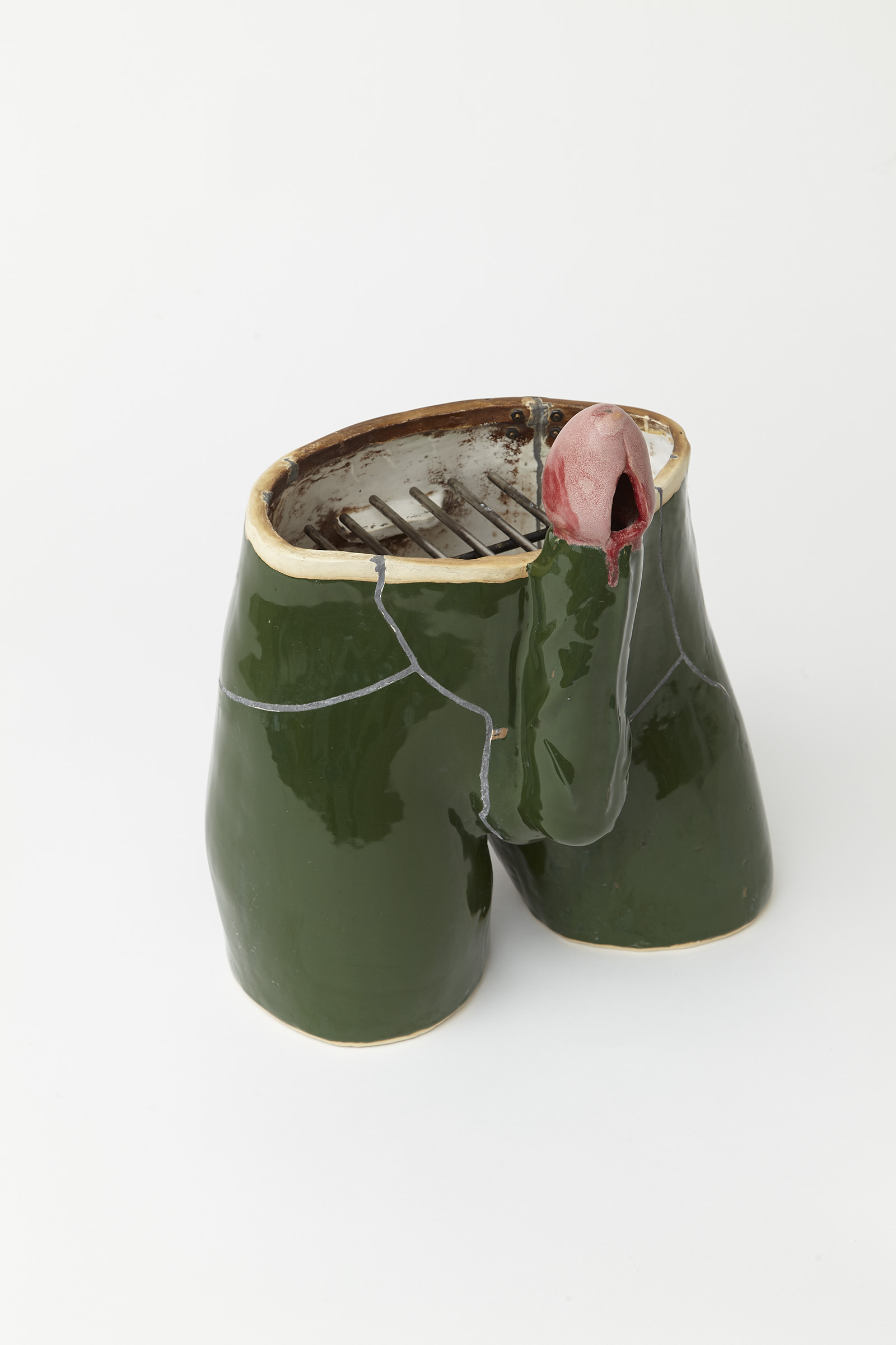 ceramic grill in the shape of male crotch
