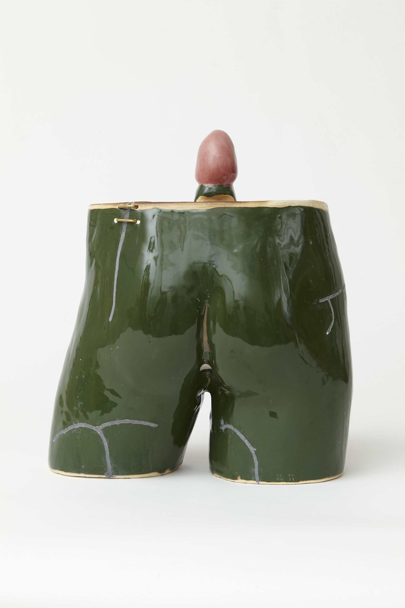 back view ceramic grill in the shape of male crotch