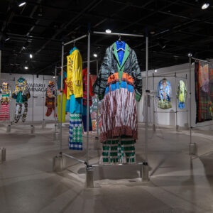 colorful clothing hanging on a metal bar apparatus