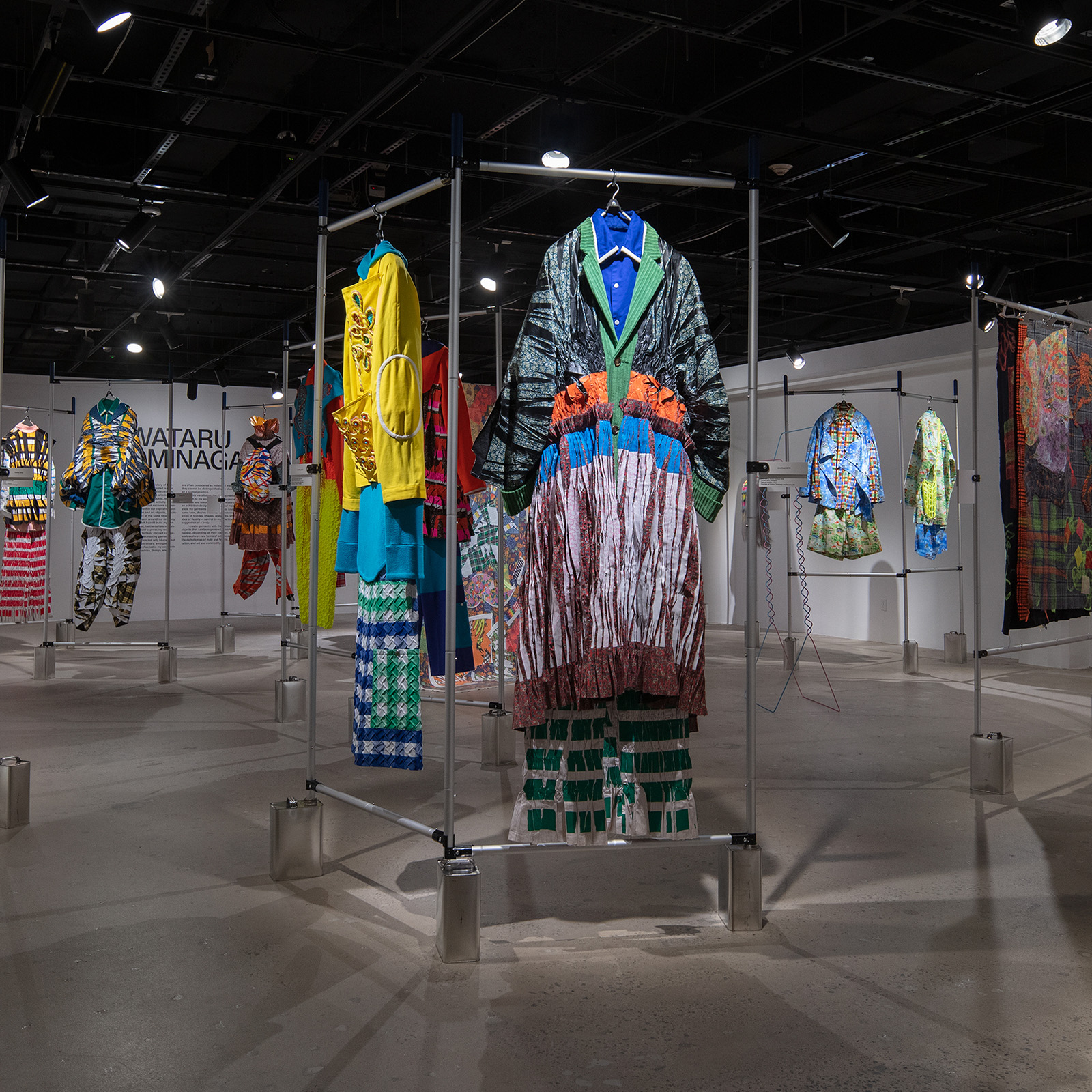 colorful clothing hanging on a metal bar apparatus
